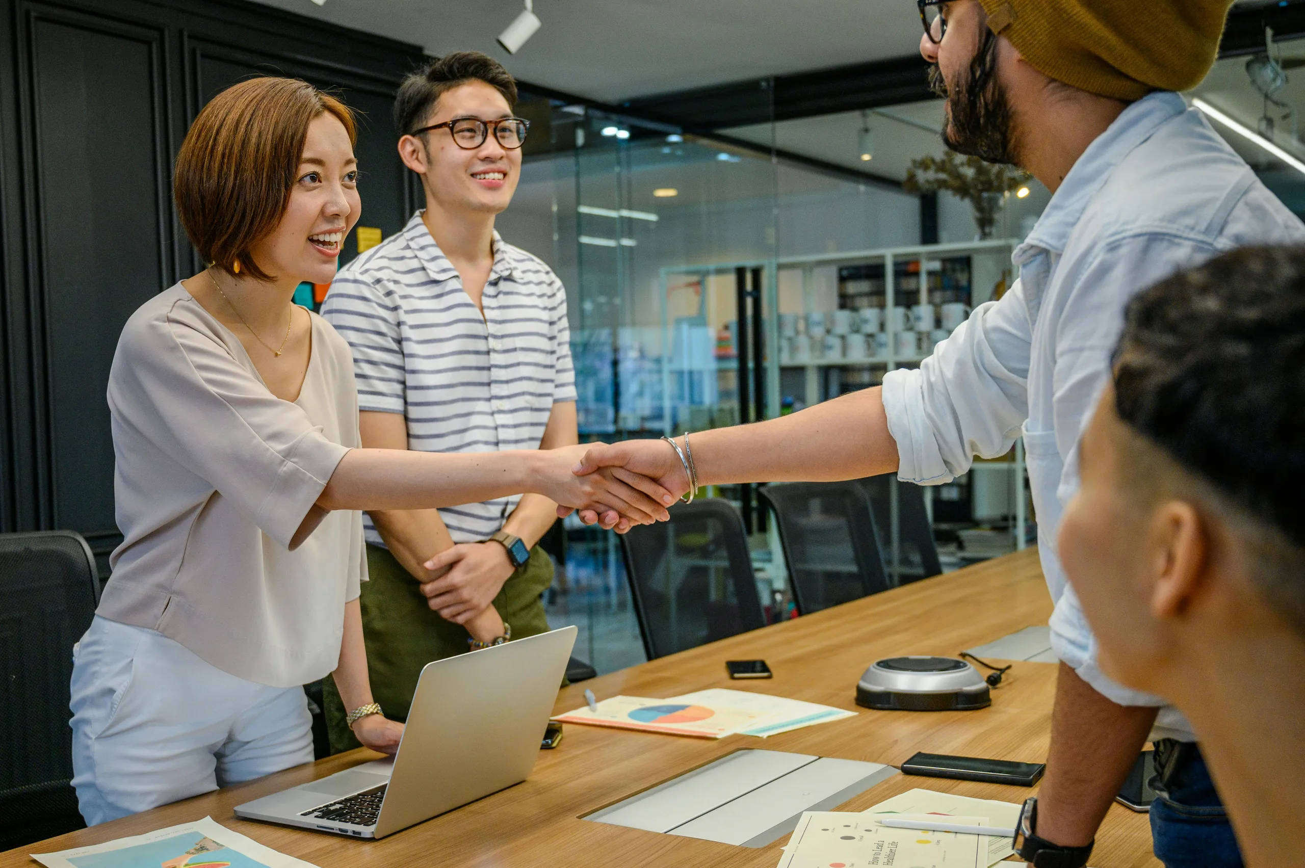 A handshake between a business owner and their MidBank advocate